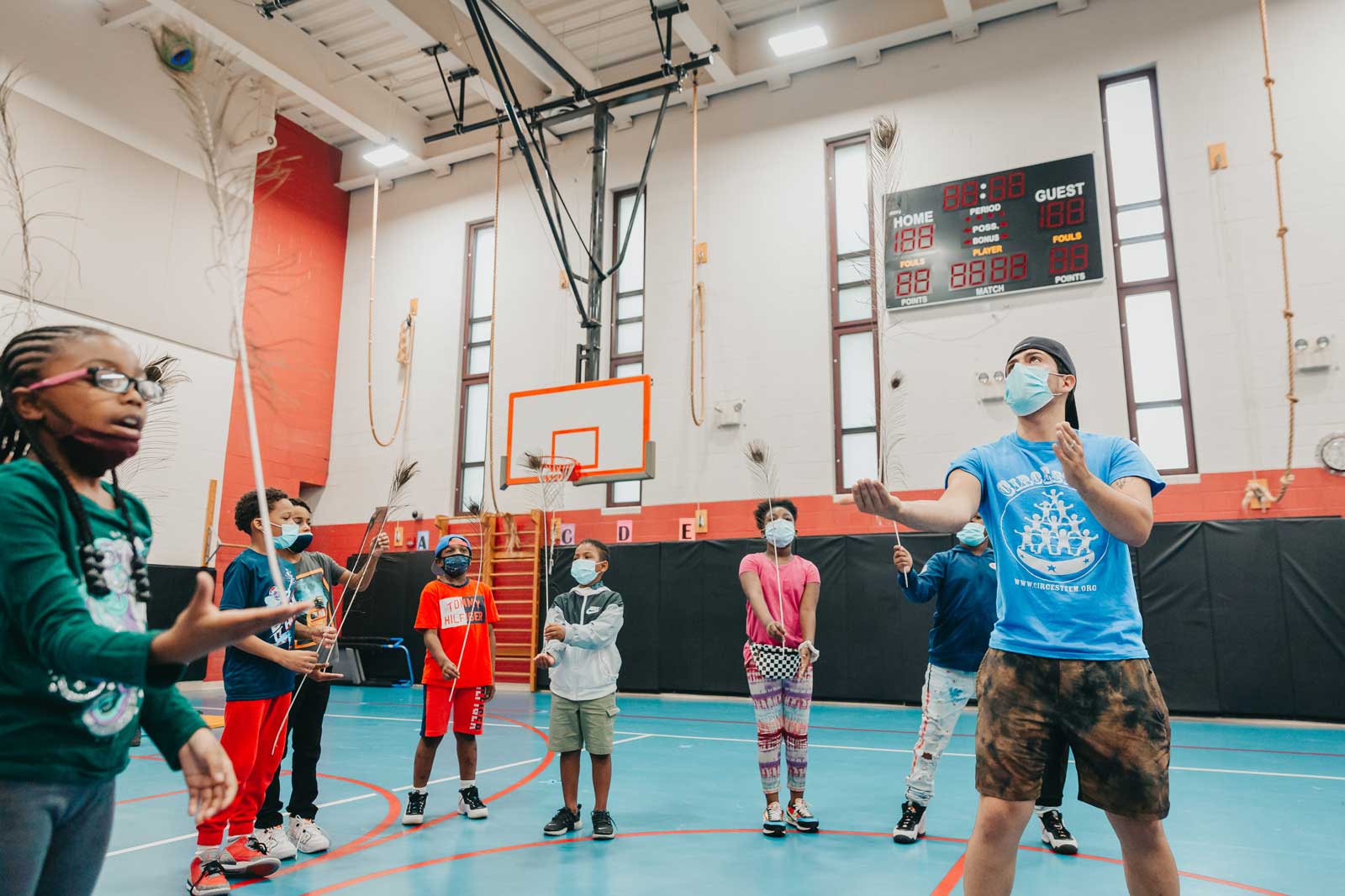Claremont-Academy-students trying to balance a feather in gym class